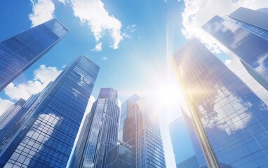 Sunlight gleams off modern financial towers under a blue sky. Low angle view of China's financial skyscrapers.