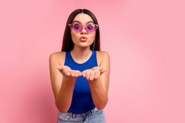 Sticker - Photo of shiny attractive lady dressed blue singlet dark eyewear sending arms kiss empty space isolated pink color background