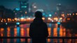 © Justlight - A lone figure standing on a bridge gazing out at the river below. The city lights reflect off the water and the persons back is turned . .