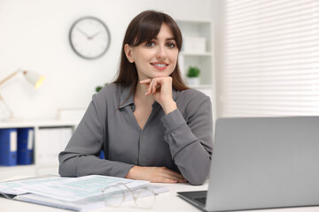 Sticker - Portrait of smiling secretary at table in office