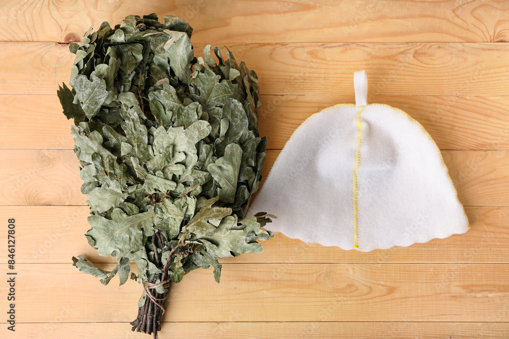 Oak broom for sauna on wooden background