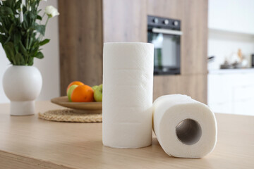 Poster - Rolls of paper towels on table in kitchen, closeup