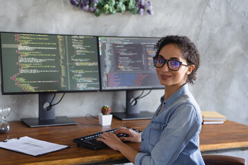 Portrait of young girl it specialist sit chair pc keyboard display loft interior business center indoors