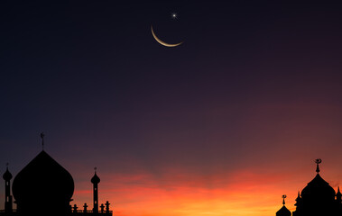 Wall Mural - silhouette dome mosques on dusk sky twilight and crescent moon on free space for text eid al adha, e