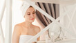 © golubovy - Morning spa. Sensual woman. Female hygiene. Confident lady smile wrapped in towel looking at mirror reflection feeling fresh after shower.
