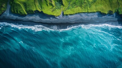 A black beach washed by the turquoise waters of the ocean or sea. A green forest belt near the beach