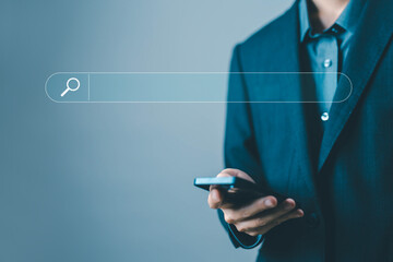 Wall Mural - businessman using a smartphone to search engine. concept of keywords show a search bar. web browser 
