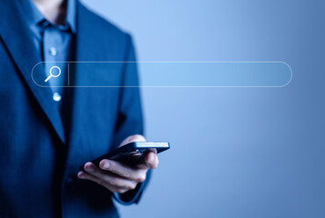 Wall Mural - businessman using a smartphone to search engine. concept of keywords show a search bar. web browser 