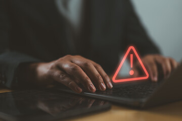 Poster - Businessman or it staff, programmer, developer using computer laptop with triangle caution warning sign for notification error and maintenance concept.