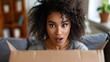 © sakareeya - A woman opening a subscription box with a look of sheer surprise, discovering unique items inside that she wasnâ€™t expecting