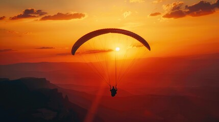 Wall Mural - a man is flying a parachute in the sky