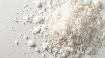 Wall Mural - Top view of a pile of natural salt on a white background
