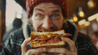 © Tomasz - Funny photo of a man passionately enjoying a New York club sandwich, advertisement style