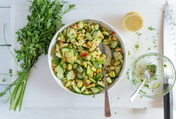 Wall Mural - Avocado, apple, cucumber Salad. Delicious healthy summer salad 