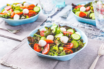 Poster - Dietary Italian salads with lettuce, tomatoes, mozzarella and cucumber