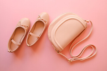 Wall Mural - Pastel colored womens hand bag on pink background. Summer fashion concept. Mockup