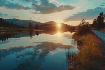 Sticker - A beautiful sunset over a lake with a reflection of the sun on the water