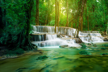 Wall Mural - Beauty in nature, amazing waterfall in tropical forest of national park, Thailand	