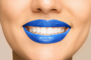 Wall Mural - Smiling woman with healthy teeth on light background, closeup view