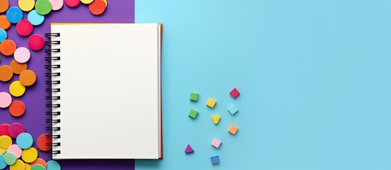 Aufkleber - Top view of an open notebook resting on a colorful background with stationery nearby Copy space image