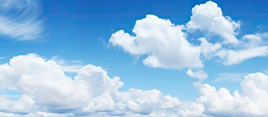 Poster - Beautiful blue sky with fluffy white clouds Copy space image