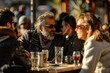 © Iigo - Unidentified people sitting at a table with drinks in a street cafe in Madrid, Spain