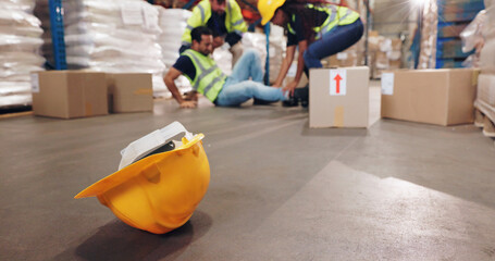 Wall Mural - Accident, fall and hardhat with man in warehouse for delivery, distribution or supply chain logistics. Fail, helmet or injury and person on floor of plant with box for ecommerce, retail or safety