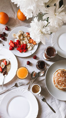 Top view of breakfast set. Pancakes, crepes with fruits and berries . Photo