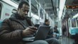 © Iuliia Metkalova - Senior multiracial african man uses his laptop and smartphone on city train. Generative ai