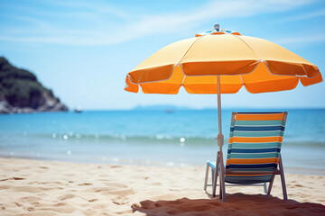 Wall Mural - Sunny day at a sandy beach with orange umbrella and chair. Shallow depth of feld