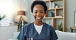 © peopleimages.com - Nurse, caregiver and portrait on sofa with smile in living room, healthcare and medicare worker. Doctor, black woman and person in nursing home or happy face for service, support and professional