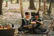 © ARMMY PICCA - Asian couple sweet in tent inside on they camping trip, traveller relax and sleep togather in out door and camping trip