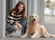 © tan4ikk - Teen Girl With Golden Retriever Near Store Plays In Spring