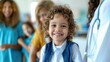 © NickArt - Close up photo of a cheerful smiling little elementary school child with family in pediatric clinic