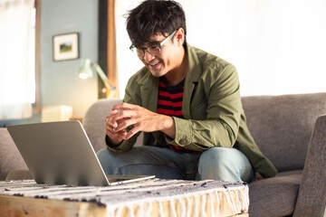 Wall Mural - asian man work using computer hand typing laptop keyboard contact us.student study learning education online.adult professional people chatting search at office.concept for technology device business