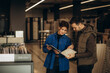 © Roman - Beautiful young couple choosing big granite tiles for their house repairment in the building shop