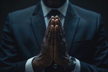 Wall Mural - A closeup of hands clasped in prayer