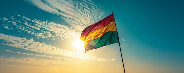 Benin flag against a clear, sunny sky