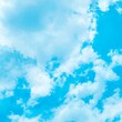 © YoYo & J studio - Blue sky with white clouds, bright colored cloudscape banner. Fluffy heaven pattern, aesthetic natural scene. Beautiful Cloudy background, nature environment wallpaper, panoramic view