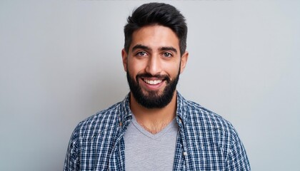 Wall Mural - A man with a beard and a blue plaid shirt 