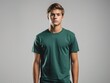 © Noppakun - Young Man in Green T-Shirt Against Gray Background