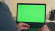 © stockbusters - Boss hand swiping touchpad on chromakey laptop starting lesson at home zoom on