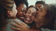© venusvi - ecstatic female designer embracing her team in a heartwarming group hug after completing a groundbreaking design project.
