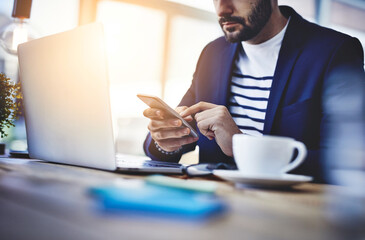 Aufkleber - Laptop, coffee and businessman with phone in cafe for online email communication for corporate review. Freelancer, cappuccino and hr with computer and cellphone for company policy with remote work.