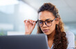 © peopleimages.com - Business woman, laptop and confused in office for planning, networking and idea with glasses. Operations manager, tech and doubt in the morning for research, development and management with question