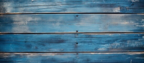 Close-up view of a weathered blue wooden wall surface showing signs of age and wear. with copy space image. Place for adding text or design