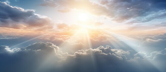 Fototapete - Sunshine penetrates fluffy clouds, casting dramatic rays of light from above the misty atmosphere. with copy space image. Place for adding text or design