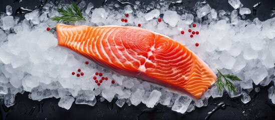 Leinwandbilder - A close-up view of a salmon fillet placed on ice garnished with pepper, highlighting its freshness. with copy space image. Place for adding text or design