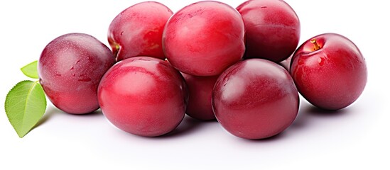 Wall Mural - Close-up view of sweet red plums with a leaf on top isolated on a white background. with copy space image. Place for adding text or design