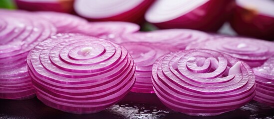 Poster - Close-up view of red onion slices on a wooden cutting board, surrounded by whole onions. with copy space image. Place for adding text or design